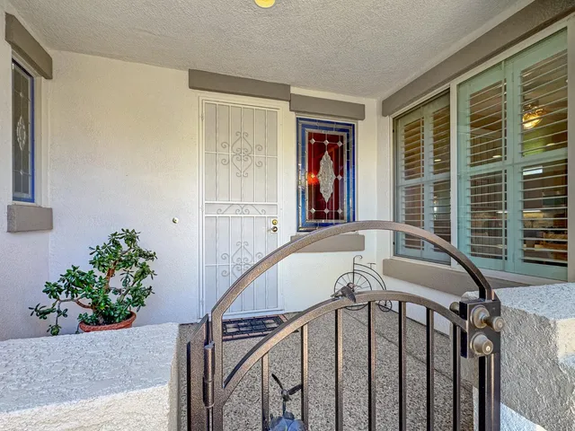 a view of entryway with a window and wooden floor