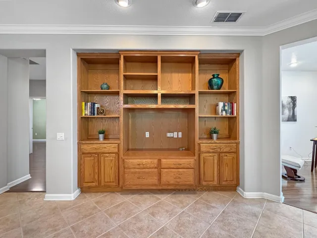 a view of walk in closet and bedroom