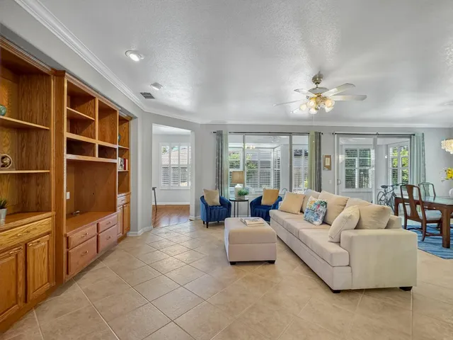 a living room with furniture and windows