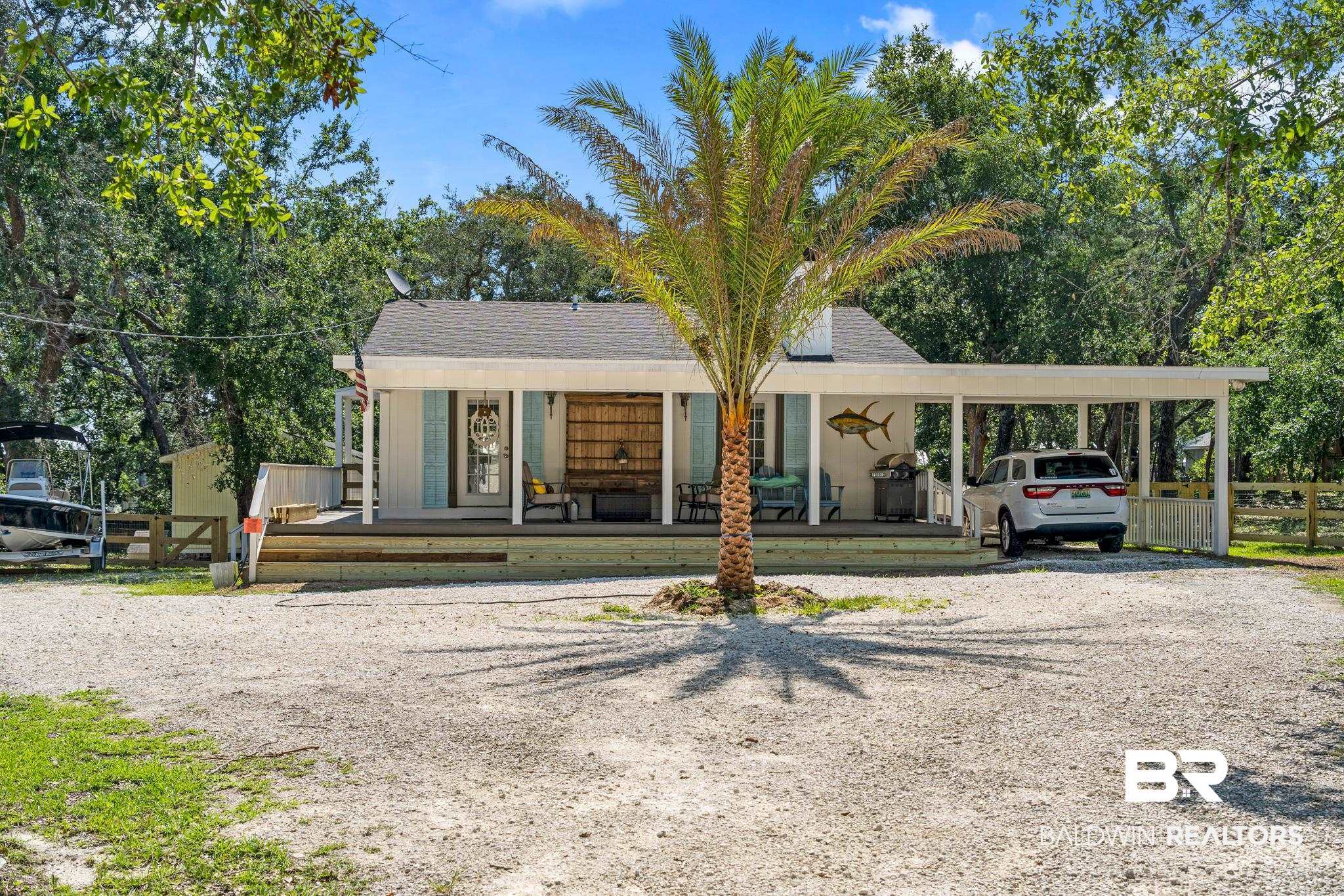5424 Greentree Road Orange Beach, AL 36561 - Photo 2 of 33 Tree lined entrance to private cottage