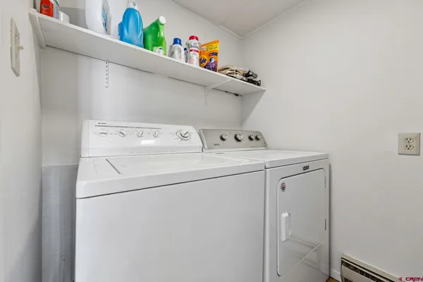 a utility room with dryer and washer