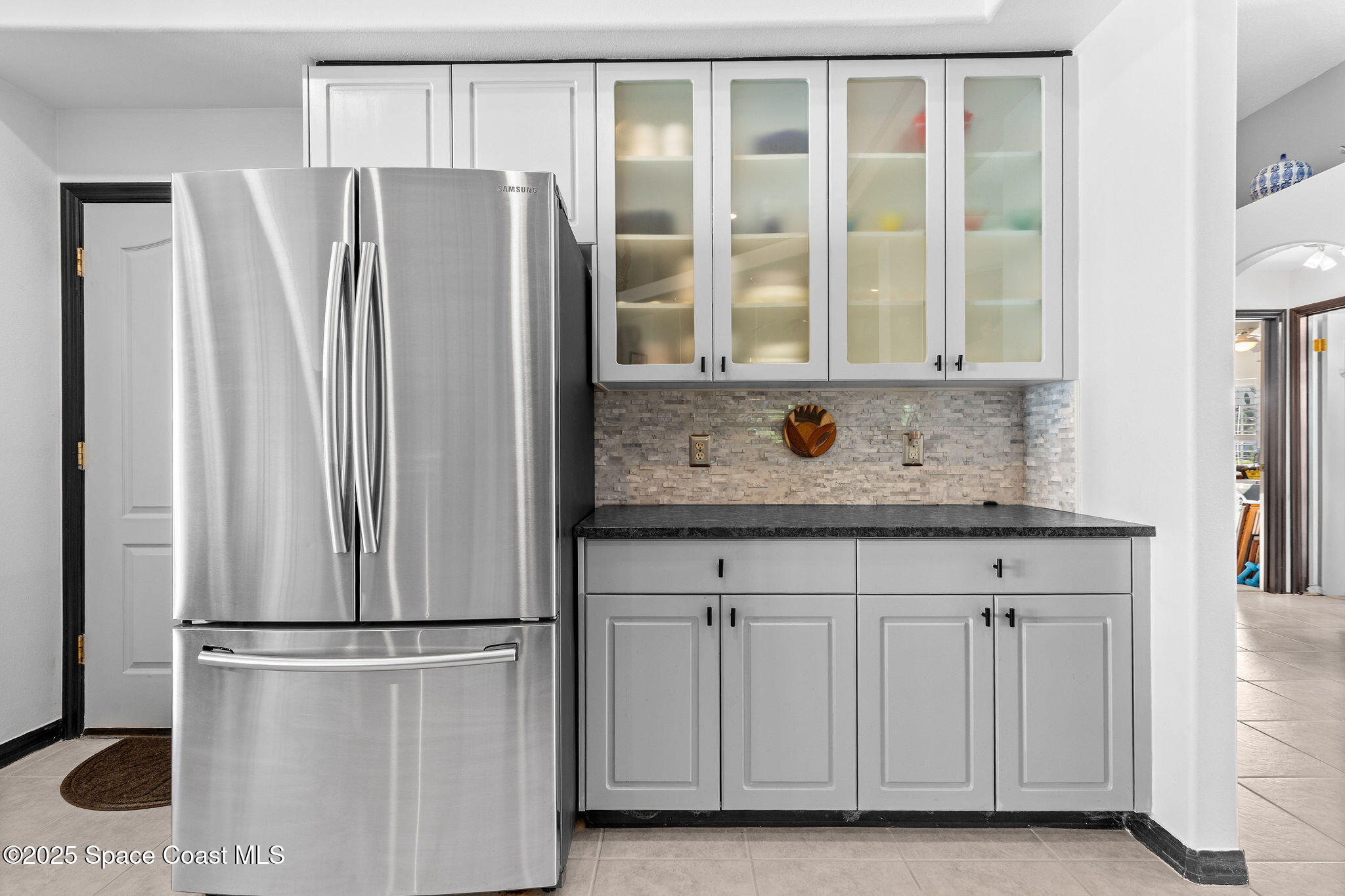 7248 Broderick Drive Melbourne, FL 32940 - Photo 11 of 51 a kitchen with stainless steel appliances granite countertop a refrigerator and a sink
