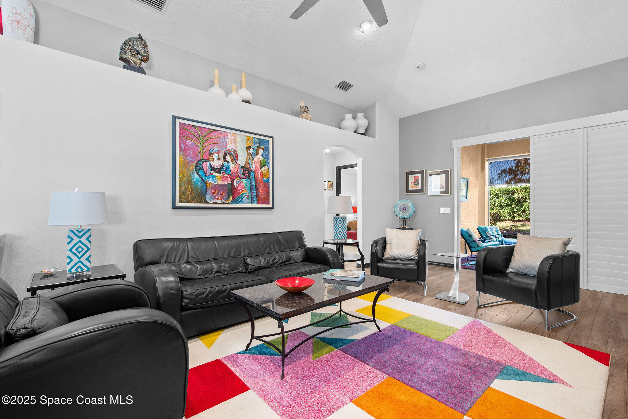 7248 Broderick Drive Melbourne, FL 32940 - Photo 13 of 51 a living room with furniture and a rug
