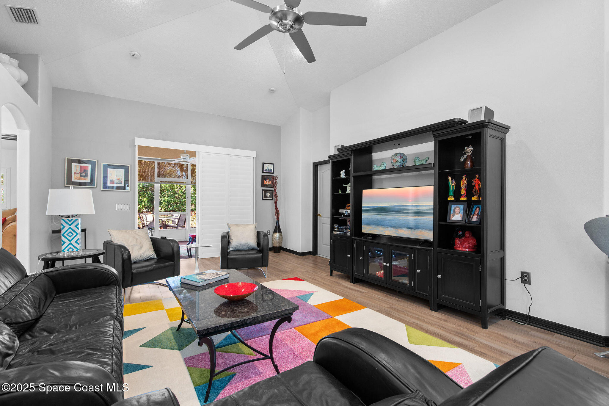 7248 Broderick Drive Melbourne, FL 32940 - Photo 14 of 51 a living room with furniture and a flat screen tv
