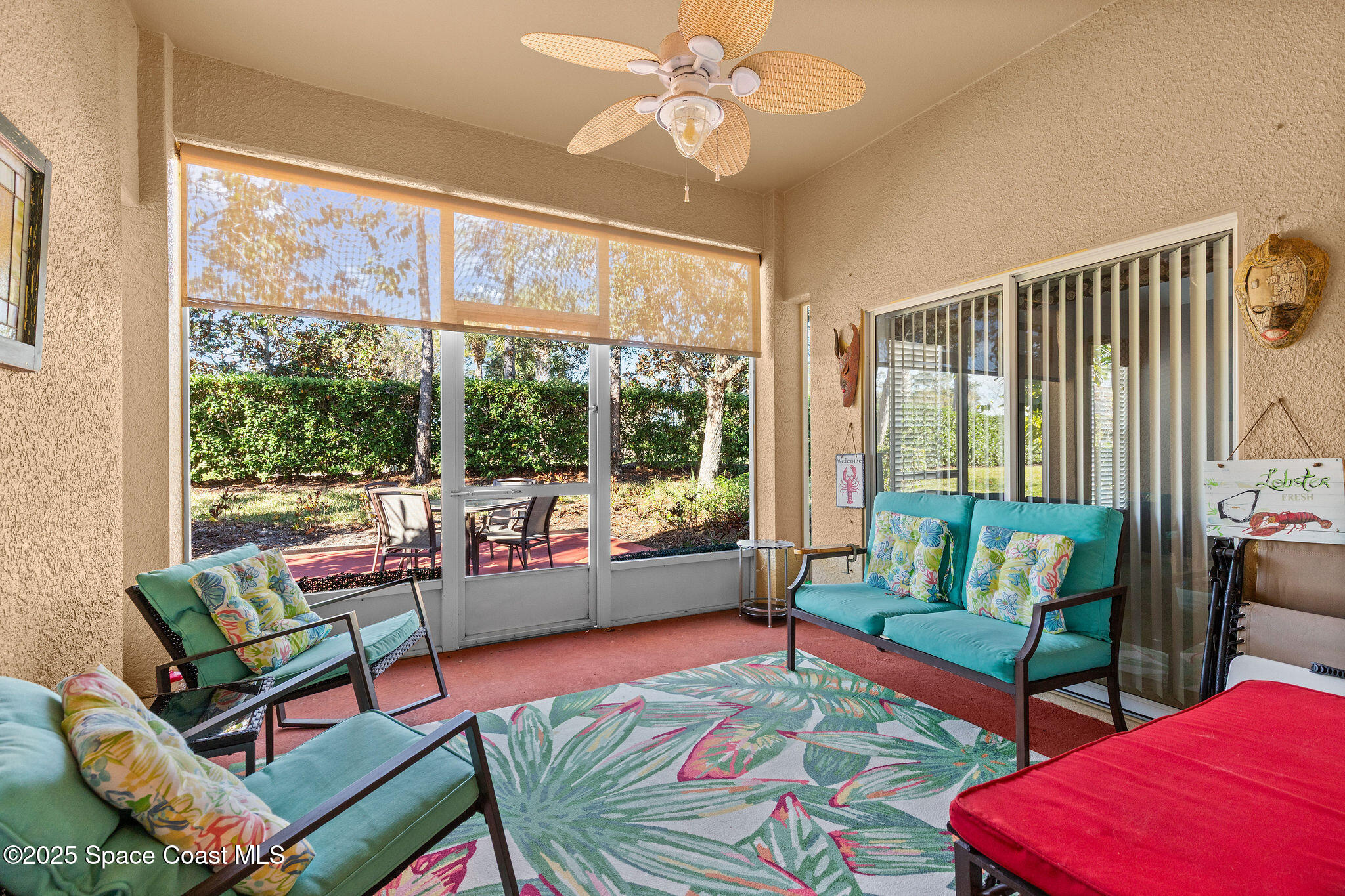 7248 Broderick Drive Melbourne, FL 32940 - Photo 28 of 51 a living room with furniture and a large window