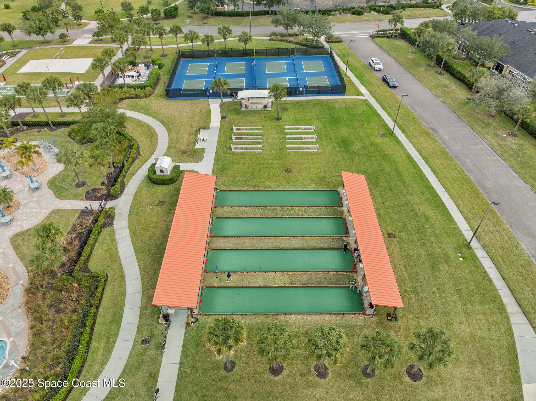 7248 Broderick Drive Melbourne, FL 32940 - Photo 36 of 51 a view of a swimming pool with a yard