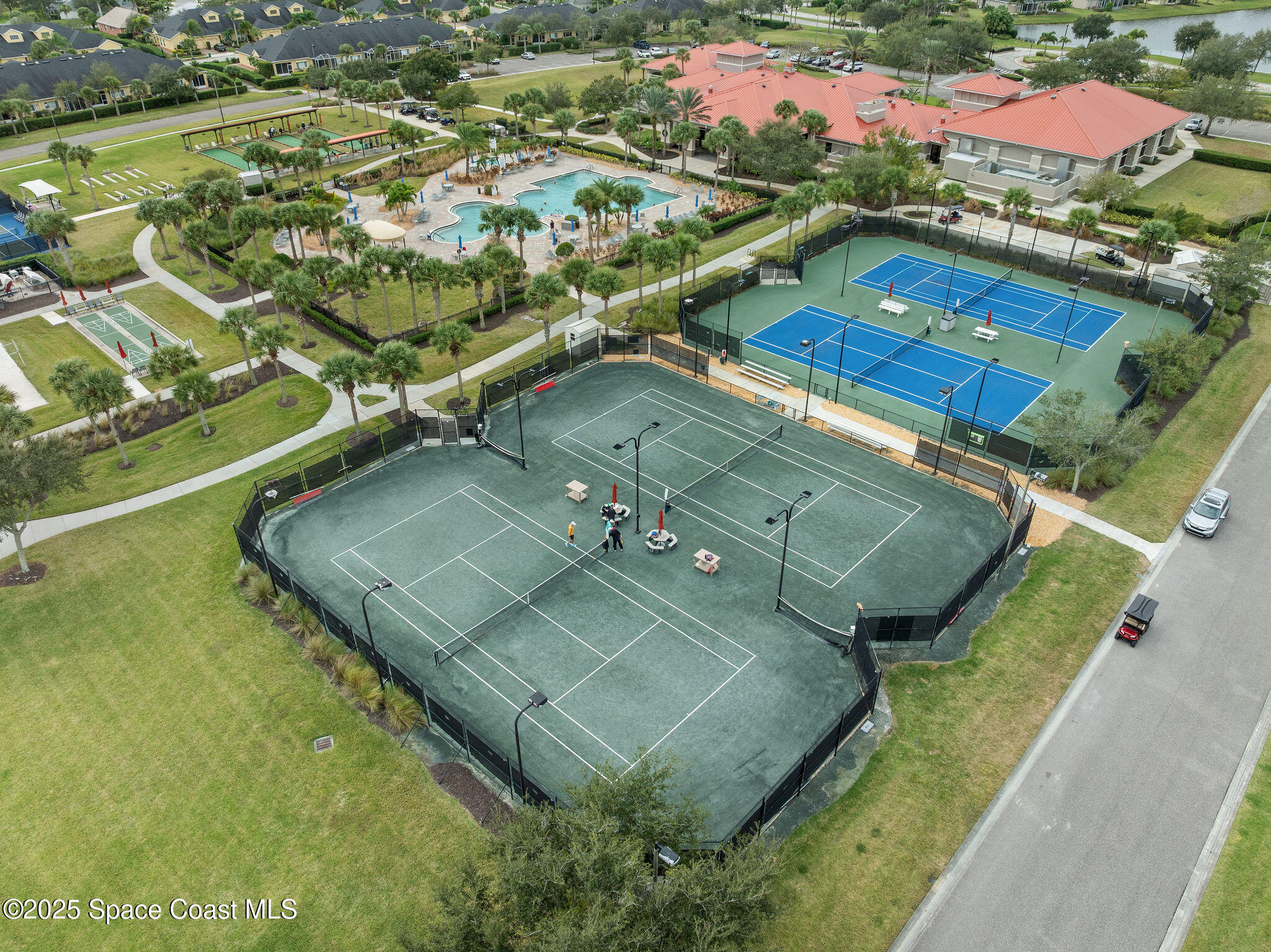 7248 Broderick Drive Melbourne, FL 32940 - Photo 40 of 51 an aerial view of residential houses with outdoor space and swimming pool