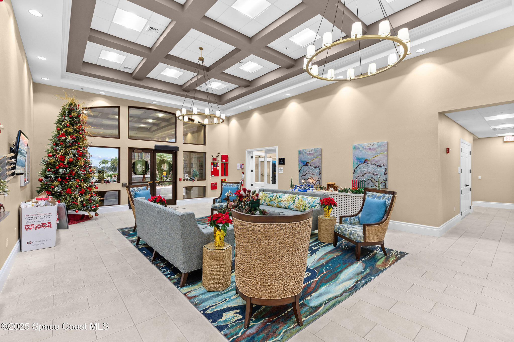 7248 Broderick Drive Melbourne, FL 32940 - Photo 43 of 51 a living room with furniture and a chandelier