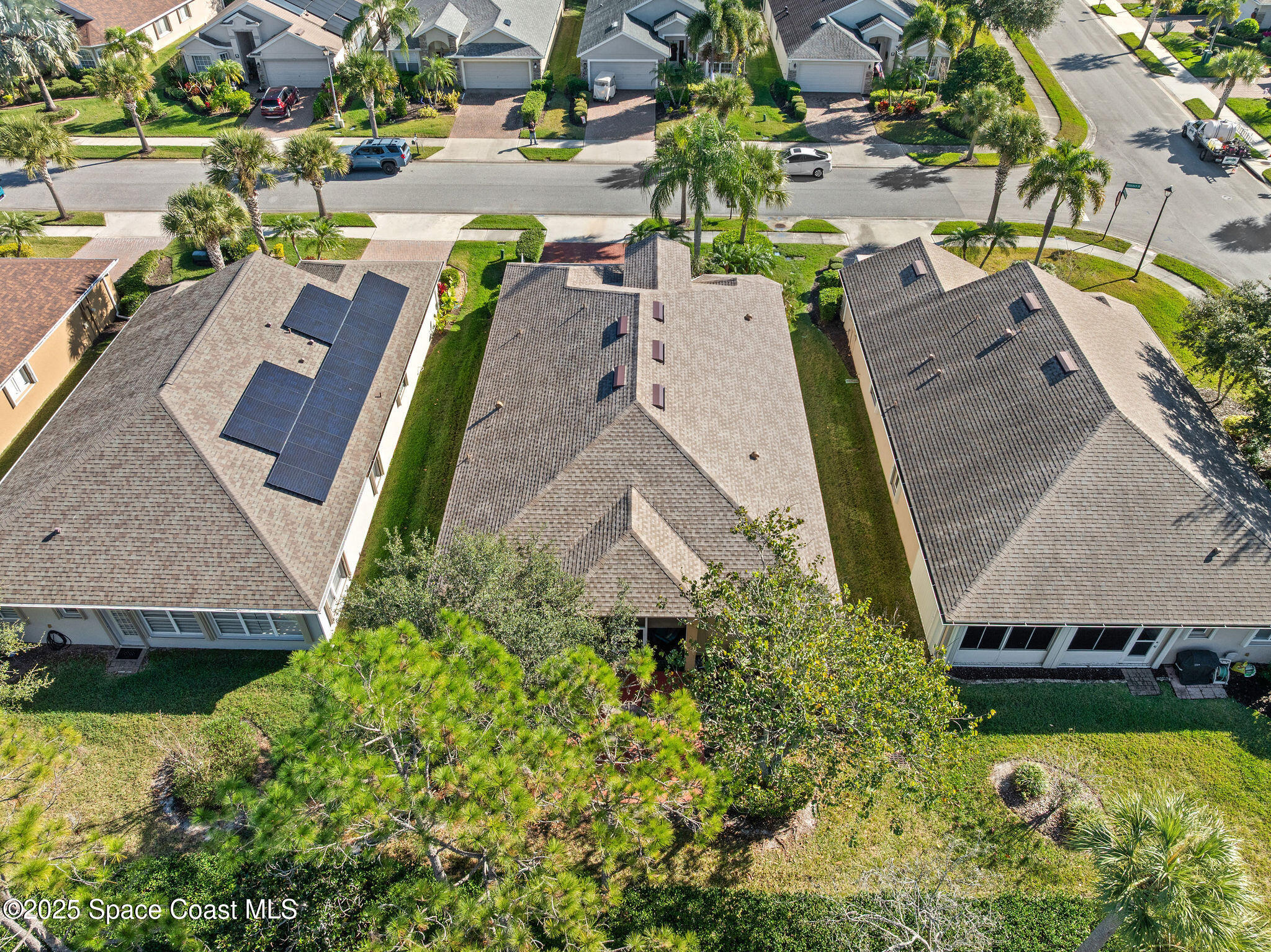 7248 Broderick Drive Melbourne, FL 32940 - Photo 5 of 51 an aerial view of a house with garden space and swimming pool
