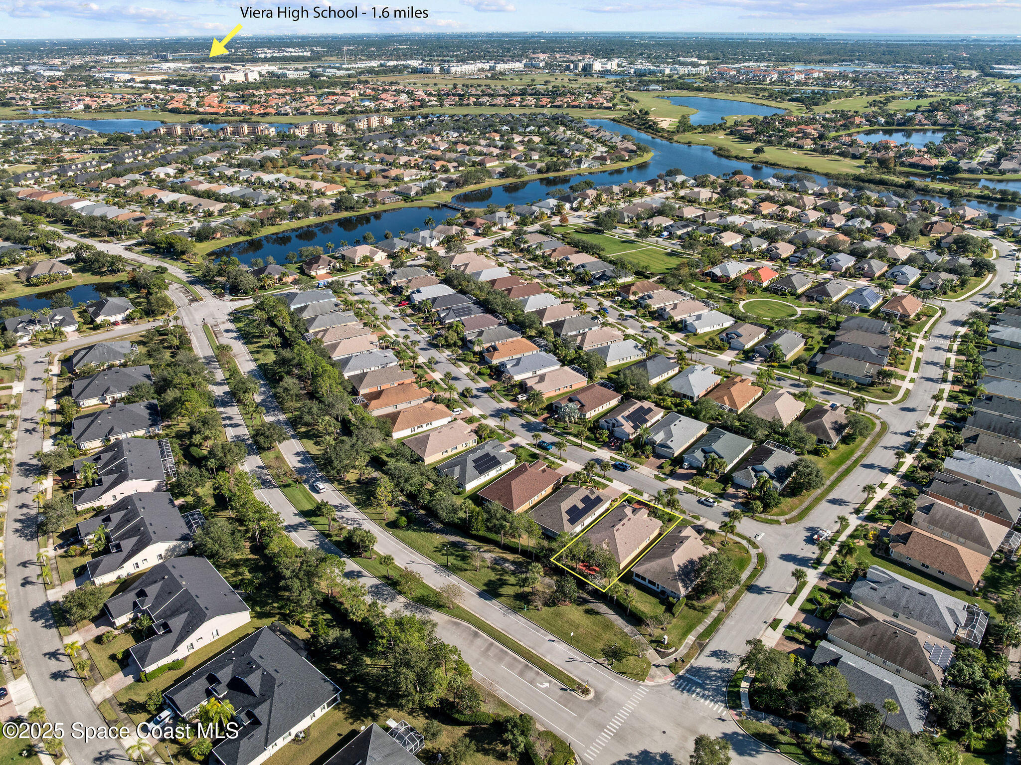 7248 Broderick Drive Melbourne, FL 32940 - Photo 6 of 51 an aerial view of a city with lots of residential buildings
