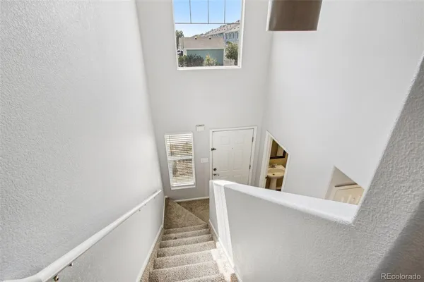 a view of a hallway with staircase