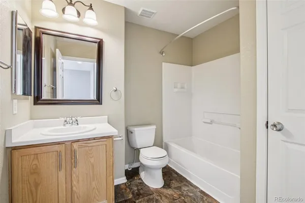 a bathroom with a toilet a sink and a bathtub