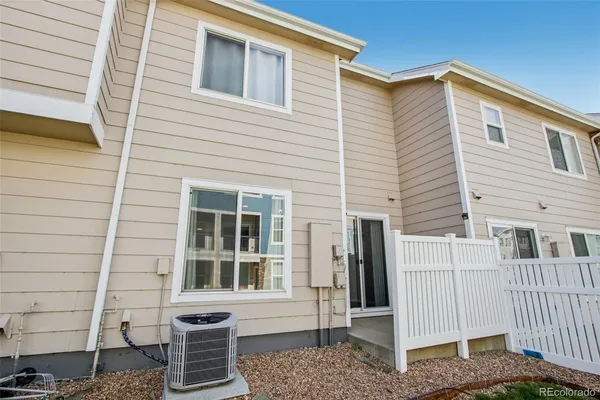 a front view of a house with a fence
