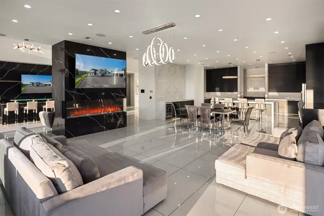a living room with fireplace furniture and a flat screen tv