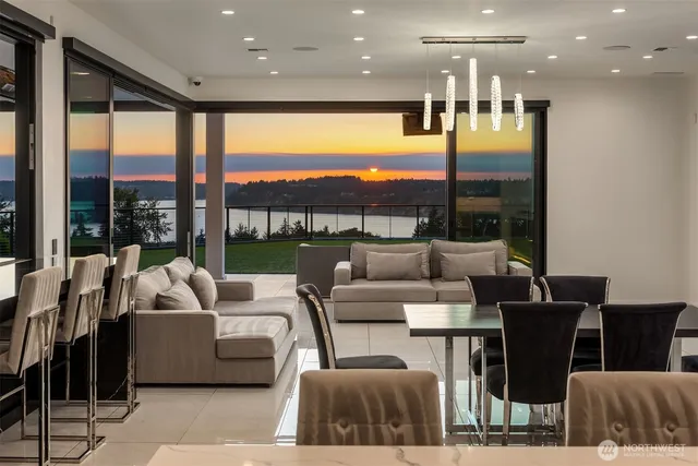 a living room with furniture city view and a floor to ceiling window