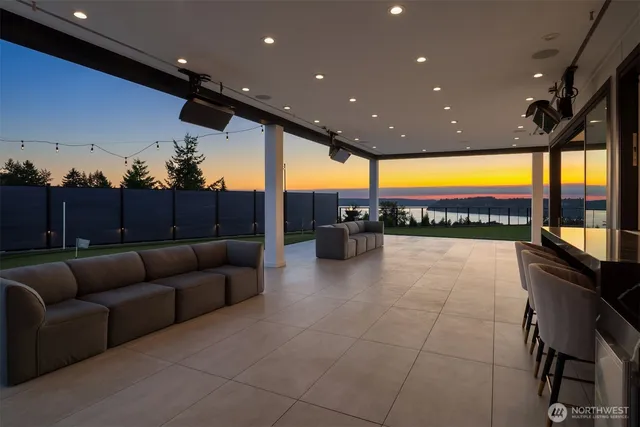 a lobby with a couch and lots of tables