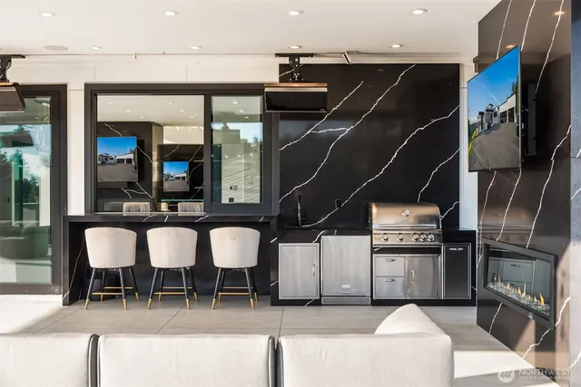 a large bedroom with a bed and glass door