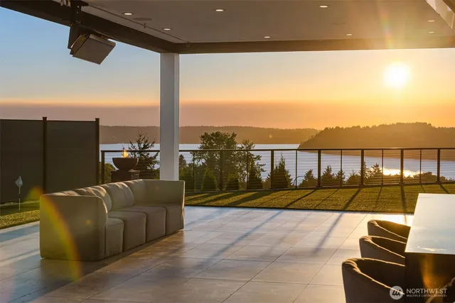 a view of swimming pool with seating area and furniture