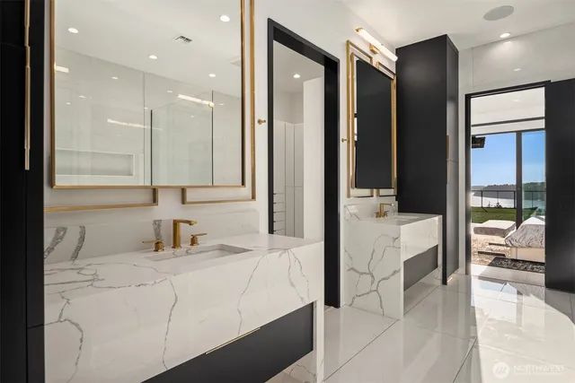 a white bath tub sitting next to a shower