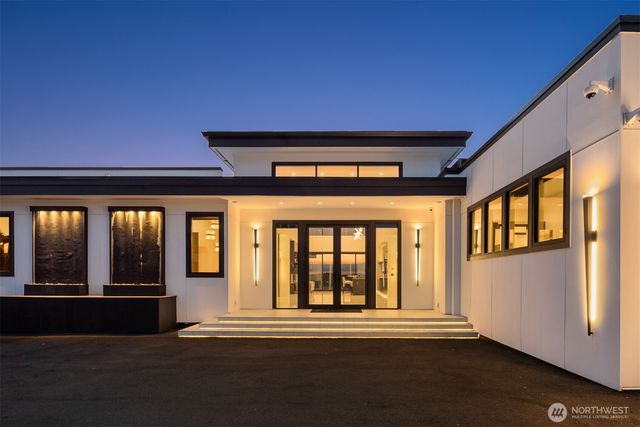 a view of swimming pool outdoor seating and city view