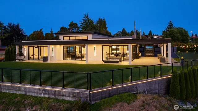 a view of a house with a wooden deck