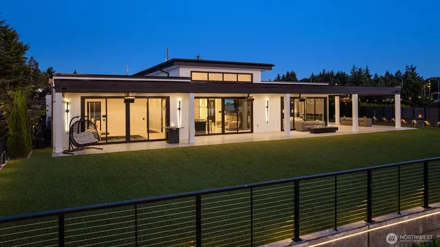 a view of a house with a backyard