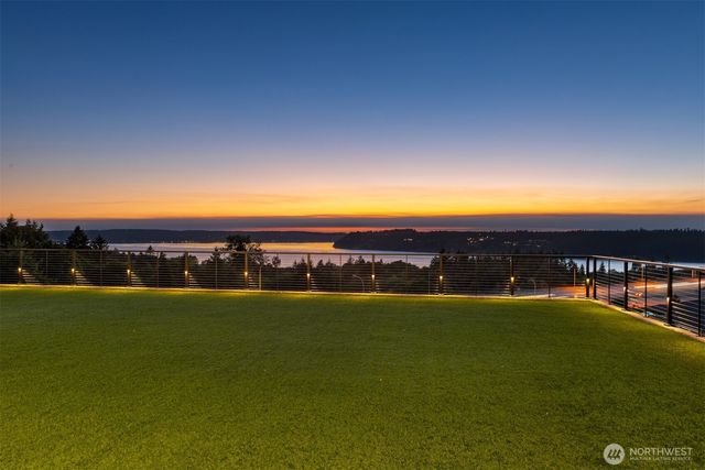 a view of an ocean and a yard