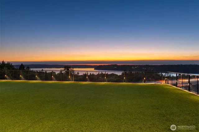 a view of an ocean and a yard