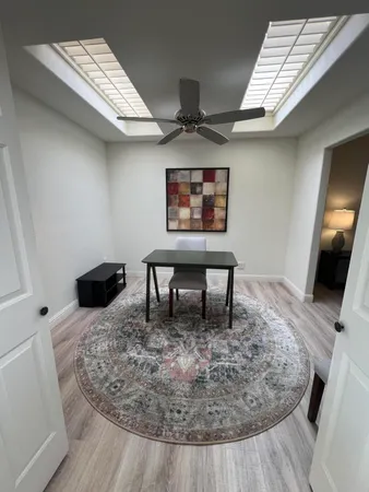 a workspace with furniture and window