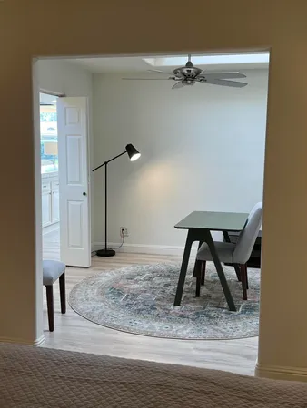 a view of a livingroom with a furniture and staircase