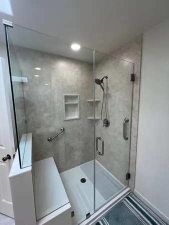 a bathroom with a glass shower door