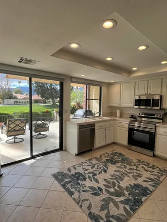 a kitchen with a sink cabinets and counter top space