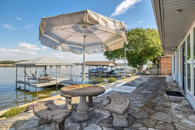 a view of a swimming pool with an outdoor seating space