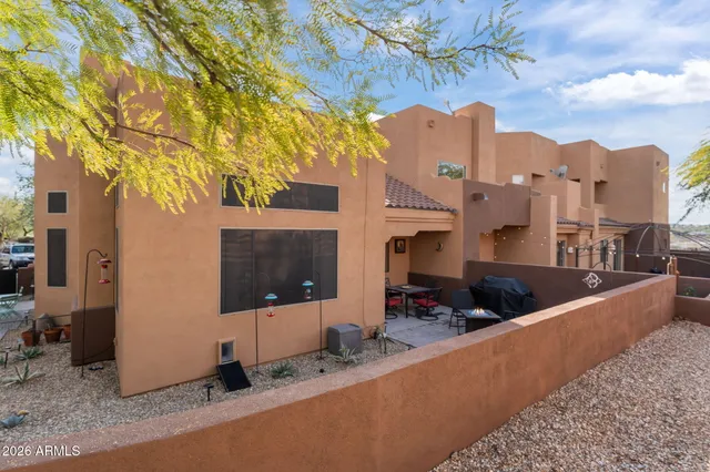 a view of a house with a sink and a fire pit