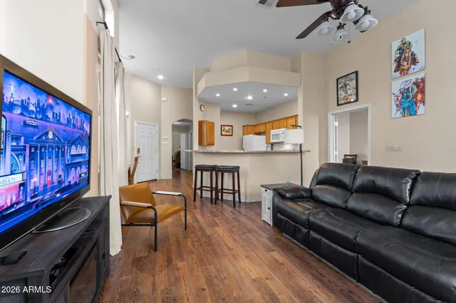 a kitchen with stainless steel appliances granite countertop a refrigerator sink and stove