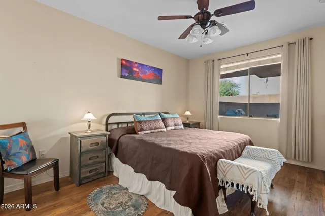 a view of a room with lots of furniture and white walls