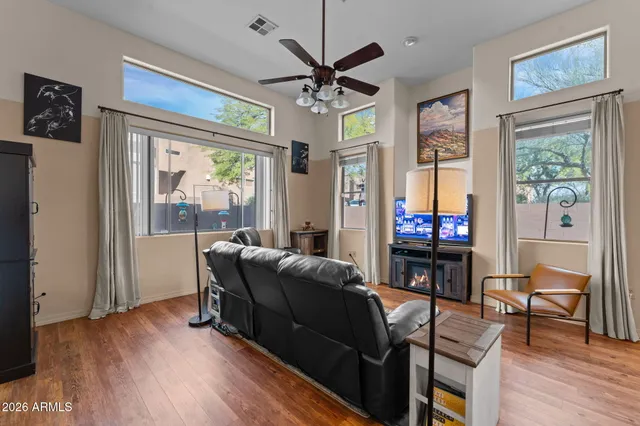a living room with furniture and a flat screen tv