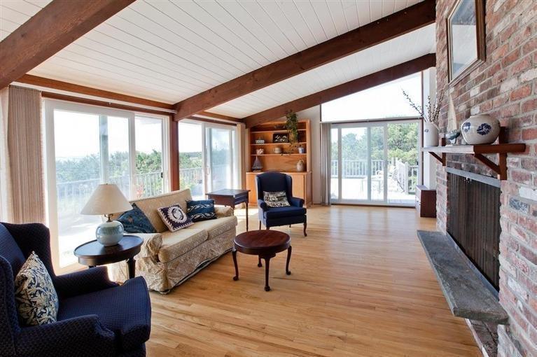 805 Chequessett Neck Road Wellfleet, MA 02667 - Photo 17 of 31 a living room with furniture and a fireplace