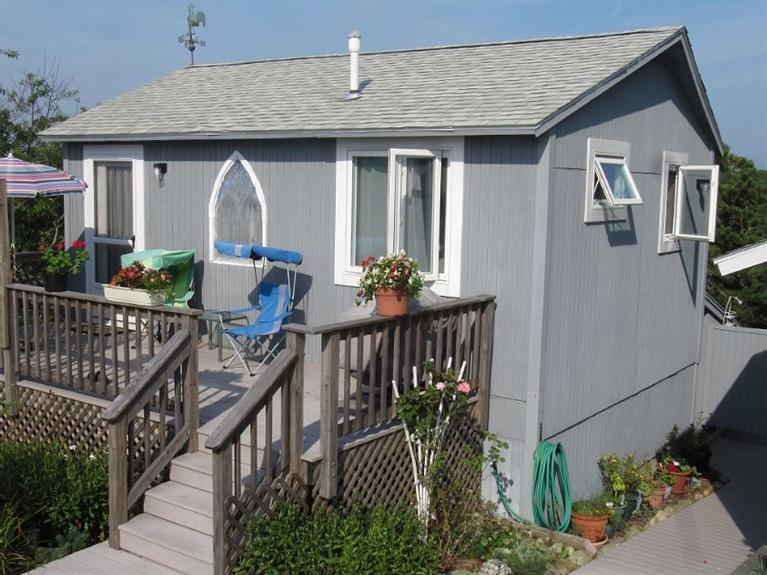 805 Chequessett Neck Road Wellfleet, MA 02667 - Photo 20 of 31 a view of a house with backyard and sitting area