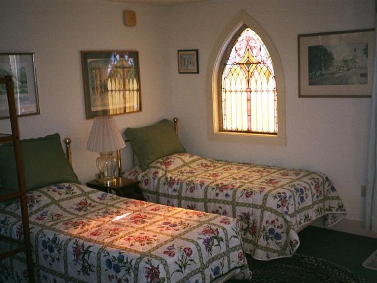 805 Chequessett Neck Road Wellfleet, MA 02667 - Photo 21 of 31 a bedroom with two beds and a window