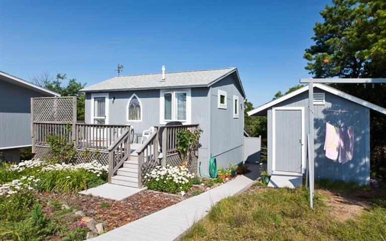 805 Chequessett Neck Road Wellfleet, MA 02667 - Photo 22 of 31 a front view of a house with a porch
