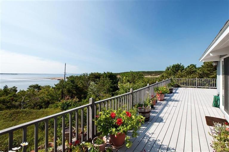 805 Chequessett Neck Road Wellfleet, MA 02667 - Photo 4 of 31 a view of a balcony with wooden floor