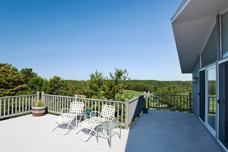 805 Chequessett Neck Road Wellfleet, MA 02667 - Photo 5 of 31 a view of balcony with furniture