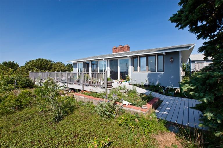 805 Chequessett Neck Road Wellfleet, MA 02667 - Photo 6 of 31 a view of house with a yard