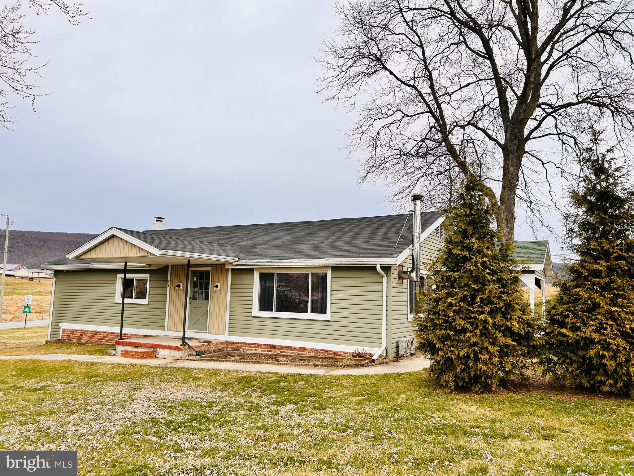 104 Apple Butter Road Aaronsburg, PA 16820 - Photo 2 of 33 a front view of a house with a garden