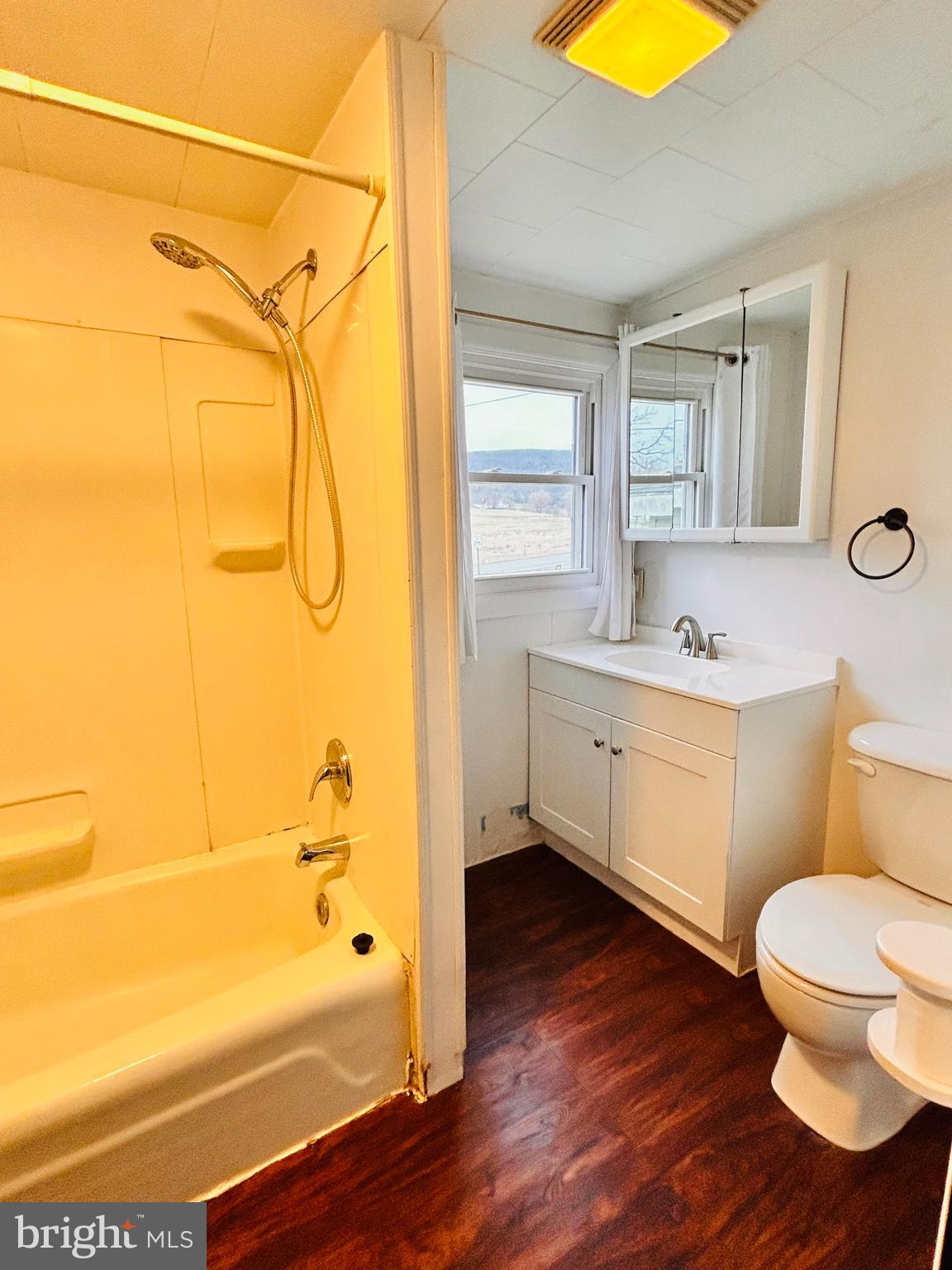 104 Apple Butter Road Aaronsburg, PA 16820 - Photo 22 of 33 a bathroom with a sink mirror vanity and toilet