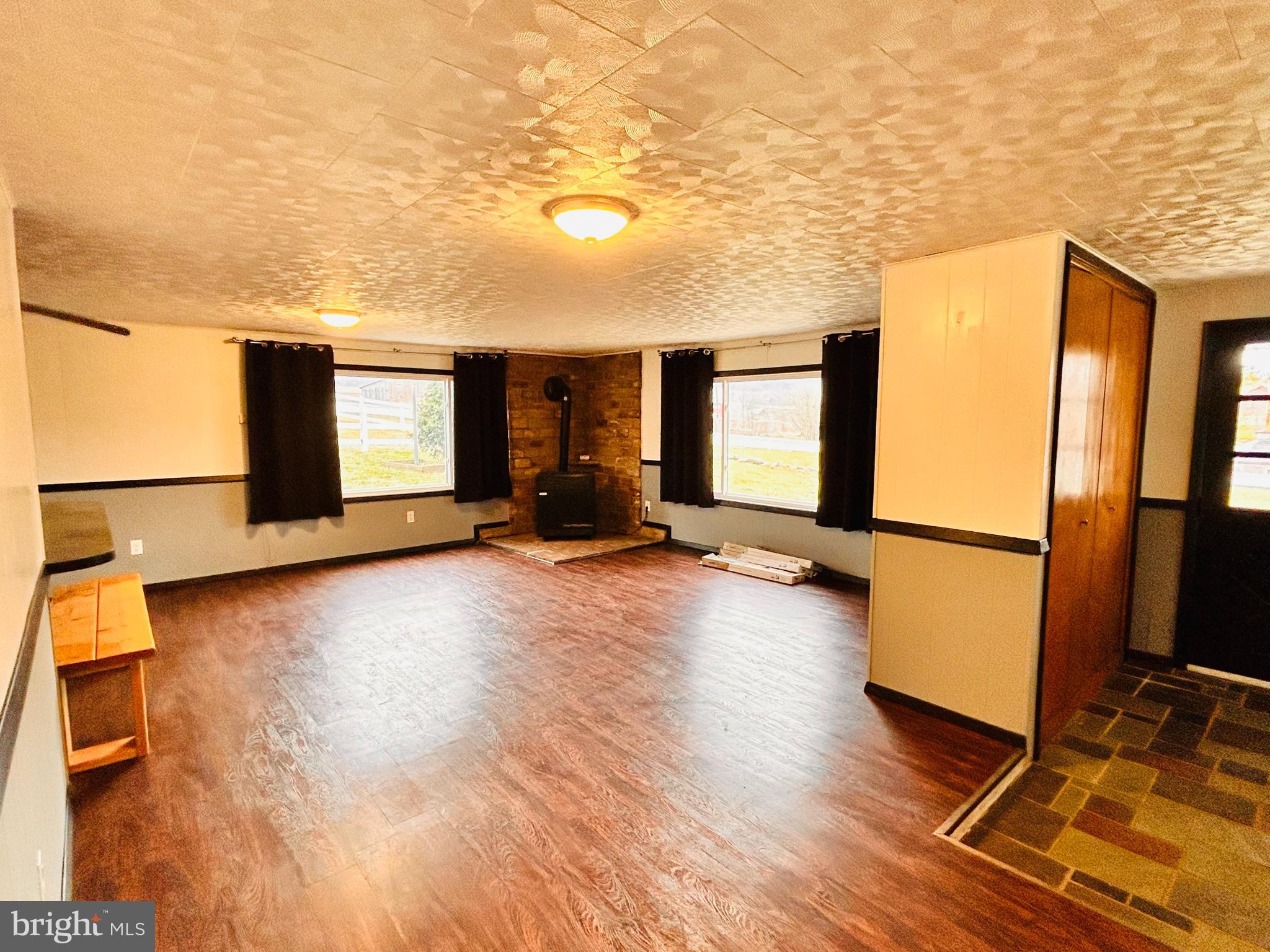 104 Apple Butter Road Aaronsburg, PA 16820 - Photo 28 of 33 a view of a room with gym equipment and a large window