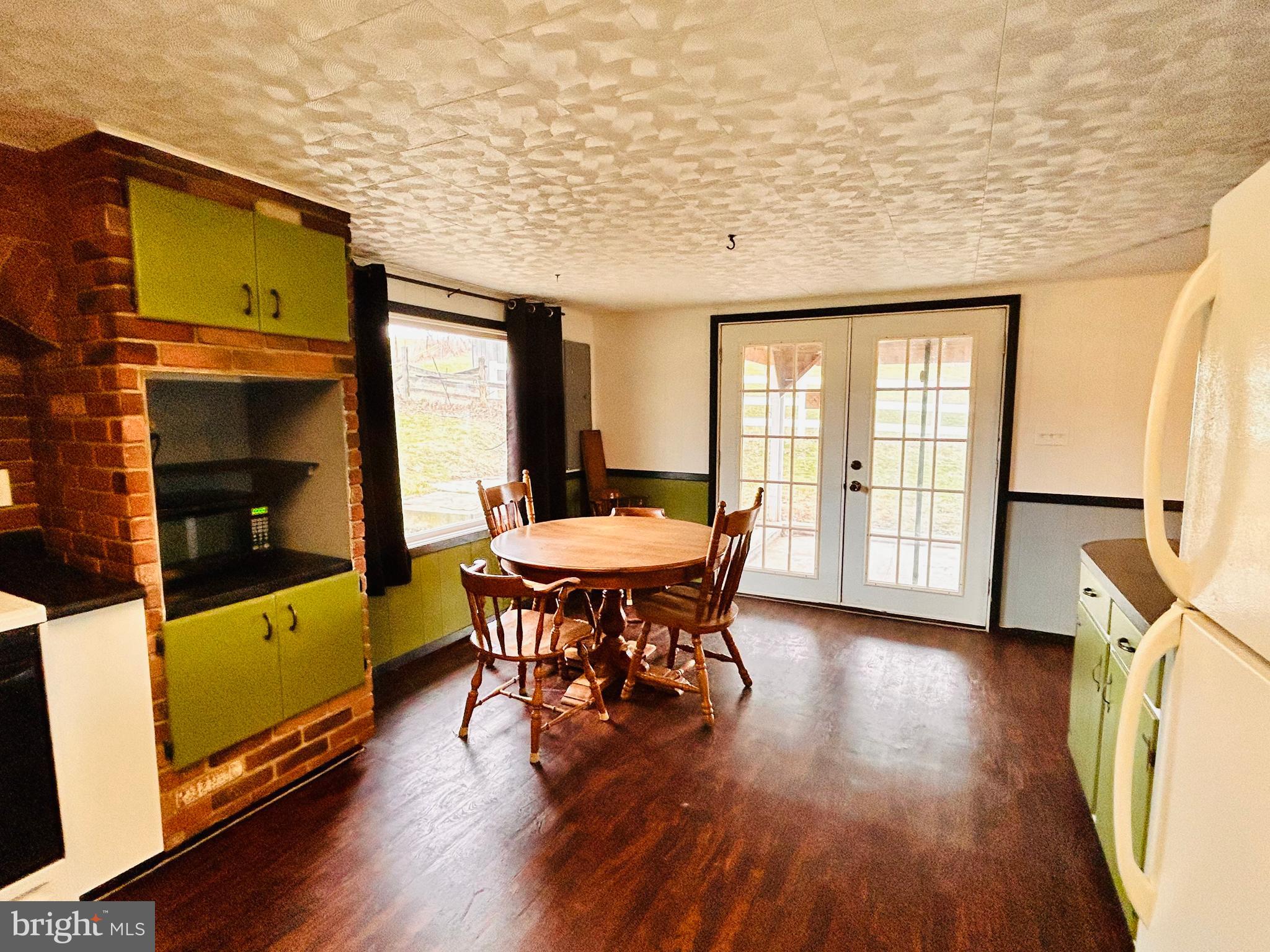 104 Apple Butter Road Aaronsburg, PA 16820 - Photo 30 of 33 a view of a dining room with furniture window and wooden floor