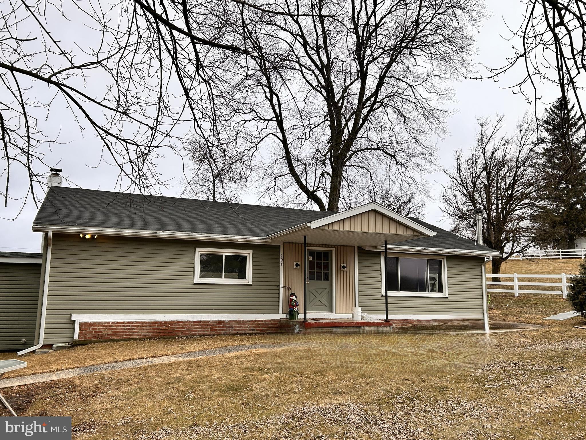 104 Apple Butter Road Aaronsburg, PA 16820 - Photo 4 of 33 a front view of a house with garden