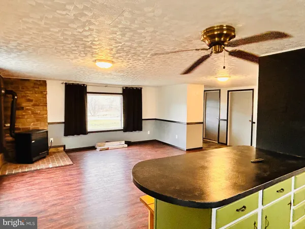 a view of a livingroom with furniture and wooden floor